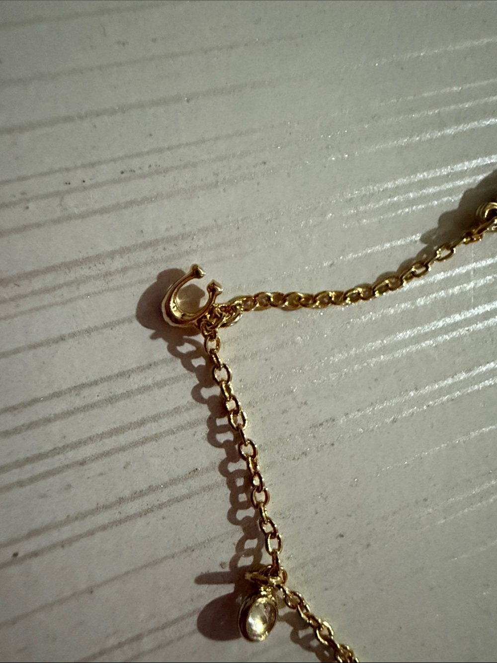 This is a Coach Mini Icons gold-tone charm bracelet. NWT $128 - Picture 2 of 6